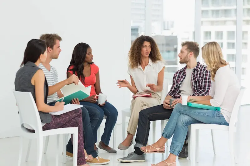Participants engage in a supportive group therapy session, a key component of our addiction treatment programs in Missouri.