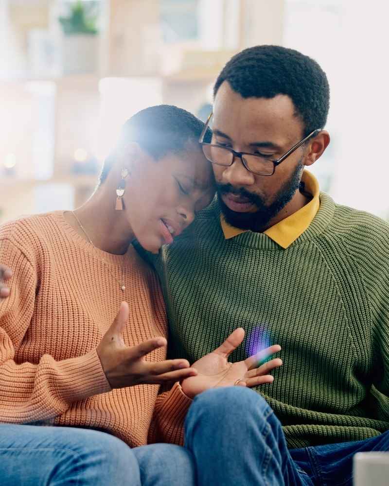 Couple sitting together and offering emotional support during oxycodone addiction recover